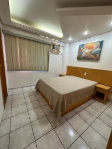 Giường trong phòng chung tại Apartamento no Centro - Família - Piscinas Quentes - Wi-Fi - Lê Jardin +11 ảnh