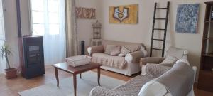 a living room with a couch and a table at Borgo Santo Stefano in Oschiri