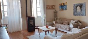 a living room with a couch and a table at Borgo Santo Stefano in Oschiri