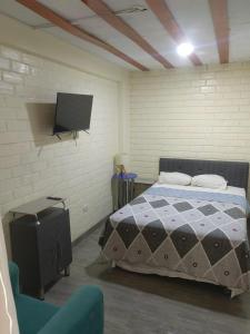 En eller flere senge i et værelse på Residencial Misky Dreams + 14 billeder