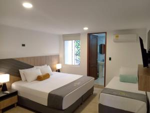 Postel nebo postele na pokoji v ubytování Buendía Hotel + 26 fotografií
