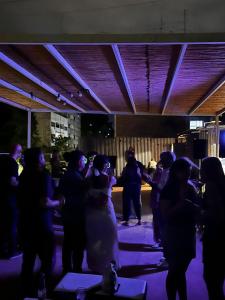 a group of people dancing at a party at Sin Fin Hostel in Mendoza