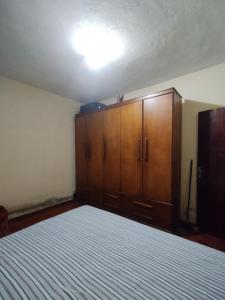 Giường trong phòng chung tại De familia para familia