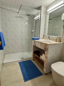 a bathroom with a shower and a sink and a toilet at Tamarán 309 in Playa del Ingles
