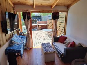 Posezení v ubytování Cabaña Jardín del Río