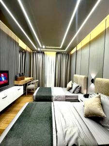 Queens Suite Hotel TV 또는 엔터테인먼트 센터