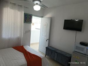 En eller flere senger på et rom på Aparta Hotel Jiménez