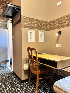 a dining room with a table and a chair at Amber Suite Szczecin hotel na Starym Mieście Adults Only in Szczecin +46 photos