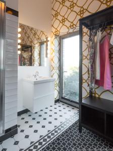 a bathroom with a sink and a mirror at Amber Suite Szczecin hotel na Starym Mieście Adults Only in Szczecin
