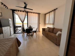 a living room with a couch and a table at Apart Ogaraity Hotel in Goya +26 photos