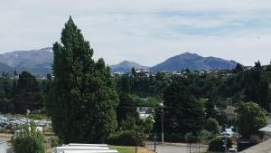a view of a city with mountains in the background at Habitación en casa de familia in San Carlos de Bariloche