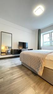 Ένα ή περισσότερα κρεβάτια σε δωμάτιο στο Home Apartments two
