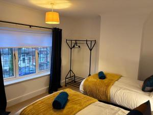 Ένα ή περισσότερα κρεβάτια σε δωμάτιο στο Cosy 2-bed NR New Cross Hospital