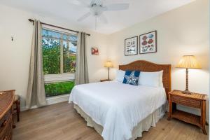 a bedroom with a bed and a window at B4 Palm Villas at Mauna Lani in Waikoloa +54 photos
