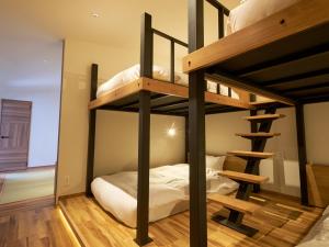 Katil atau katil-katil dalam bilik di Hakuba Ryujin Onsen RYOKAN SUI