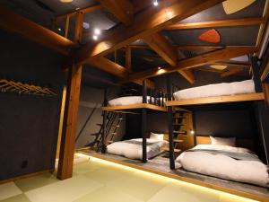 Katil atau katil-katil dalam bilik di Hakuba Ryujin Onsen RYOKAN SUI