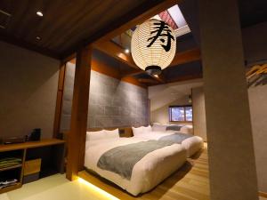 Katil atau katil-katil dalam bilik di Hakuba Ryujin Onsen RYOKAN SUI