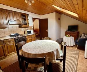 a kitchen with a table with a table cloth on it at Apartments by the sea Zavalatica, Korcula - 9137 in Zavalatica