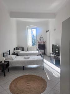 Ένα ή περισσότερα κρεβάτια σε δωμάτιο στο Rossese di sera