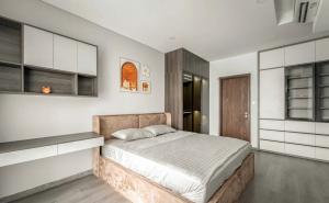 a bedroom with a large bed and white cabinets at FLC Sea Tower Quy Nhơn-Codotel 5 Sao Giáp Biển-Trung Tâm TP Quy Nhơn in Quy Nhon