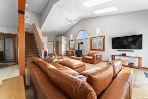 a living room with a couch and a tv at 1101 Mesa Drive: 2 in Silverthorne