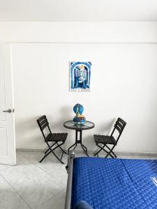 a table and chairs in a room with a table at Departamento Completo Centro Historico in Mexico City