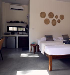Ένα ή περισσότερα κρεβάτια σε δωμάτιο στο Origen Bungalows & Yoga Shala +14 φωτογραφίες