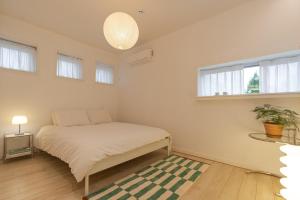 Ένα ή περισσότερα κρεβάτια σε δωμάτιο στο Hug Jeju