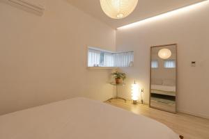 Ένα ή περισσότερα κρεβάτια σε δωμάτιο στο Hug Jeju +24 φωτογραφίες