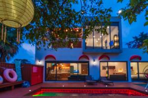 a house with a pool in front of it at Its you Pool Villa in Jeju