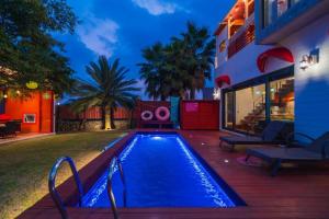 a swimming pool in the backyard of a house at Its you Pool Villa in Jeju