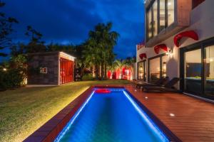 a swimming pool in the yard of a house at Its you Pool Villa in Jeju