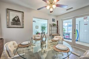a dining room with a glass table and chairs at Satchell's Lakehouse in Inverness