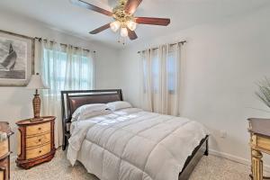a bedroom with a bed and a ceiling fan at Satchell's Lakehouse in Inverness +25 photos