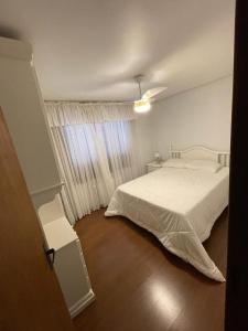 Postel nebo postele na pokoji v ubytování Apartamento 3 dormitórios no Condomínio Lage de Pedra em Canela