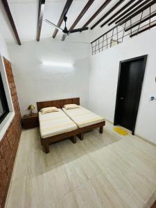 a room with a bed in the middle of it at The Grove, Kamshet, Near Lonavala, India - Luxury Villa in Khamshet