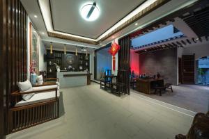 FenghuangQixin Guesthouse的休息区