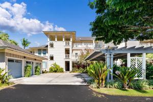 a large white house with a driveway at F22 Waikoloa Fairway Villas in Waikoloa