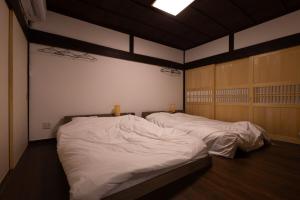 MEMORY GATEWAY HOTEL 101 Katayamatei客房内的一张或多张床位