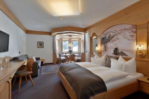 TV a/nebo společenská místnost v ubytování Hotel Almhof