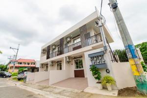 a building with a pole in front of it at Modern Comfort at Unit 105 in Batangas City