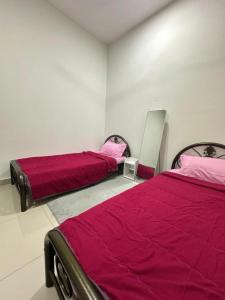 Postel nebo postele na pokoji v ubytování D'Sally Homestay KLIA Sepang