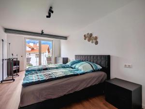 Ένα ή περισσότερα κρεβάτια σε δωμάτιο στο Breitenbergerhof Pfronten