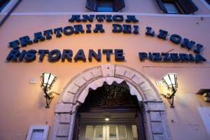 a building with a sign above a doorway at Albergo Dei Leoni in Monterotondo