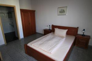 Postel nebo postele na pokoji v ubytování Hotel Avalon