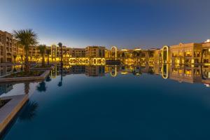 a view of a large pool of water with buildings at Pickalbatros White Beach Resort - Hurghada in Hurghada
