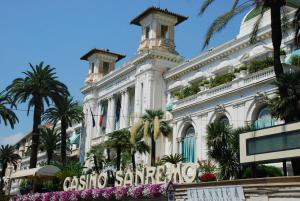 a large building with a large clock on the front of it at Le Camere Di Nana' in Sanremo