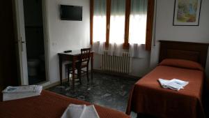 Postel nebo postele na pokoji v ubytování Albergo Sonia