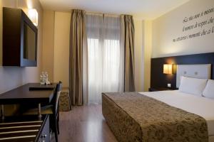 Postel nebo postele na pokoji v ubytování Hotel Executive