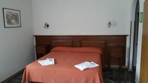 Postel nebo postele na pokoji v ubytování Albergo Sonia